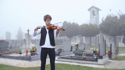 Playing violin on funeral