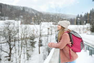 Fototapeta premium Beautiful woman at snowy resort