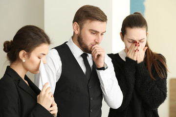 Pining relatives at funeral