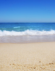 Fototapeta na wymiar Bali beach blue sea and sky resort travel tourism. Clear water and golden sand.