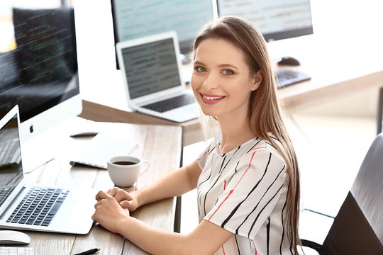Portrait of female programmer in office