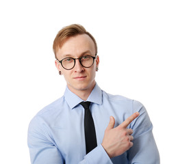 Handsome stylish businessman pointing at something on white background