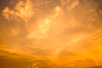 Fototapeta na wymiar Cloudy sky and orange light of the sun through the clouds.