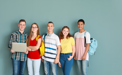 Group of teenagers on color background