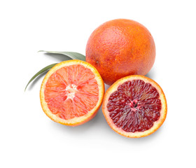 Tasty blood oranges on white background