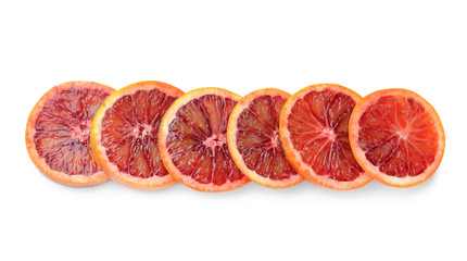 Slices of fresh blood orange on white background