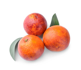Tasty blood oranges on white background
