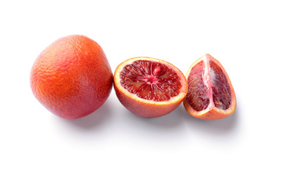 Tasty blood oranges on white background