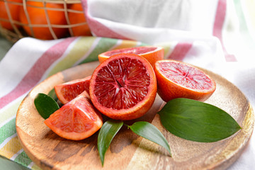 Fototapeta na wymiar Fresh blood oranges on plate