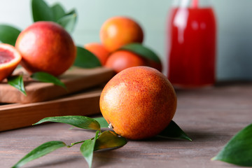 Fresh blood orange on wooden table