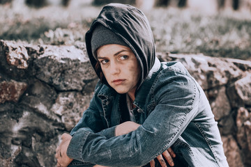 Poor homeless woman outdoors