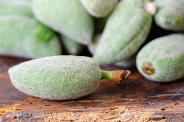Stack of Fresh Green Almond Fruits On Table