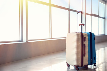 Suitcases in hall of airport. Travel concept