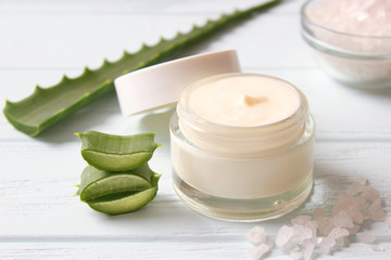 cream with aloe vera on a light background. Aloe vera skin care. Moisturizing and skin care.