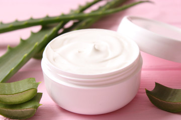 cream with aloe vera on a light background. Aloe vera skin care. Moisturizing and skin care.