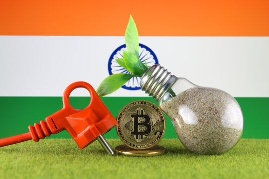 Bitcoin (BTC), green renewable energy concept, and India Flag. Electricity prices, energy saving in the cryptocurrency mining business.