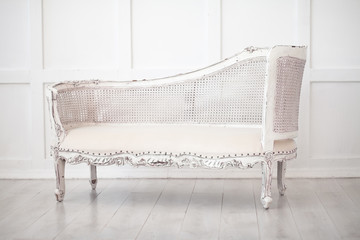 Cozy retro vintage sofa in white room