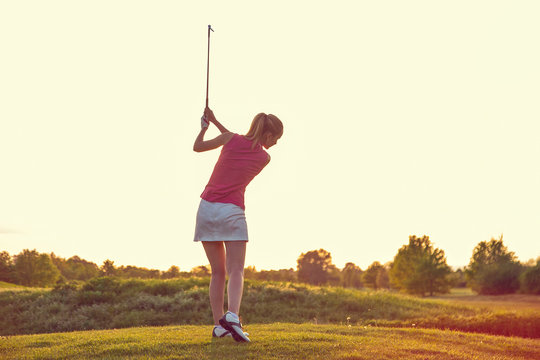 Beauty Cheerful Young Adult Girl Playing Golf at Sunset Beautiful Golf Course
