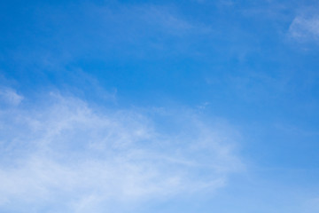 Naklejka na ściany i meble The background of a beautiful sky with a thin white cloud