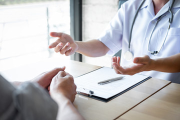 Doctor consulting with patient examining for patient, presenting results symptom about the problem and recommend treatment method, Healthcare and medical concept