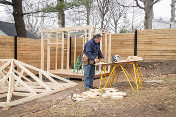 carpenter working on wood structure