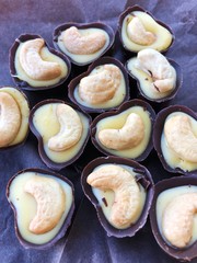 Delicious chocolate candies with mango and nut 