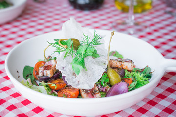 healthy food background or texture, fresh tasty vegetable salad with red fish, tomatoes, balsamic spicy