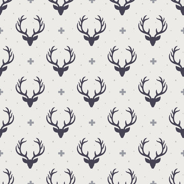 Fototapeta Reindeer seamless pattern background, deer head silhouette with antlers, modern scandinavian background, nordic style