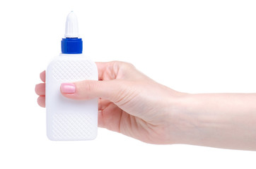 White bottle glue in hand on white background isolation