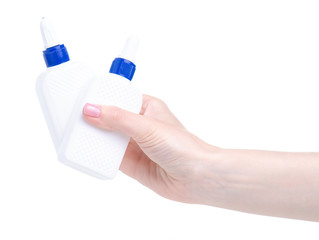 White bottle glue in hand on white background isolation