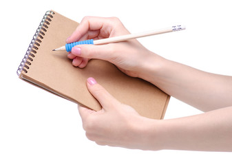 notepad and pencil in hand on white background isolation