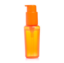 Orange sunscreen suntan bottle on a white background. Isolation