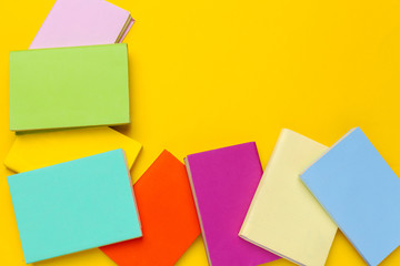 Books on a yellow background