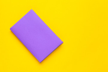 Books on a yellow background