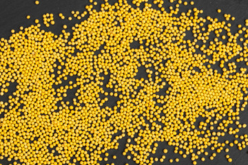 Colored sugar candy sprinkles confetti close up view