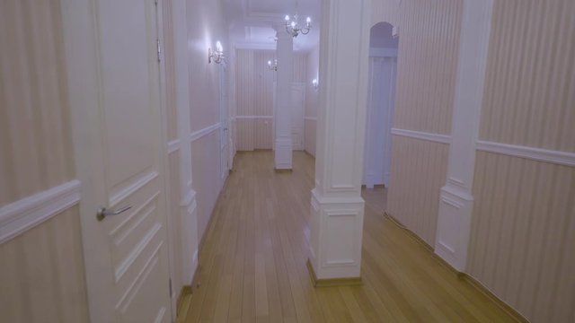 Steadicam shot of a mini hotel corridor