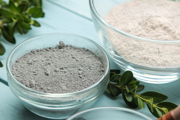 Cosmetic clay. clay facial mask on a gentle blue background. different types of clay. natural...