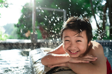 Little boy in the pool. Summer holiday concept