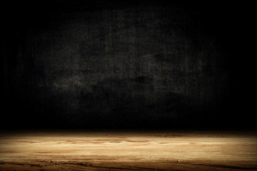 Dark desk background of free space for your decoration and black wall space 