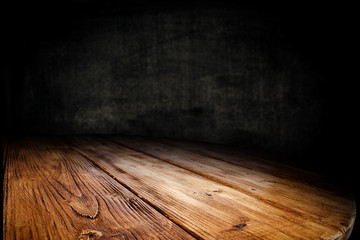 Dark desk background of free space for your decoration and black wall space 