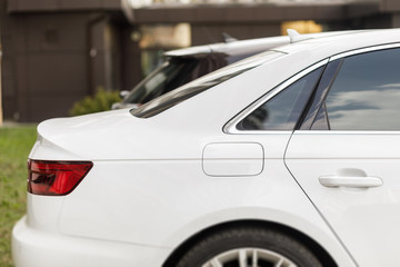 Fototapeta premium Back lights of white car. New modern sports car.