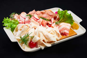 meat and sowbelly set. pub, restaurant, bar food concept. meat appetizers set with meat, sowbelly, tomatoes cherry, souses and fresh greens.
