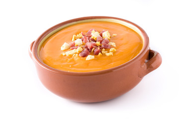 Typical Spanish salmorejo cream with ham and egg isolated on white background. Close up