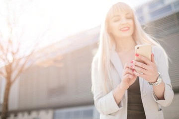 Elegant business woman in sunglasses with phone.  Business Woman with phone near office.