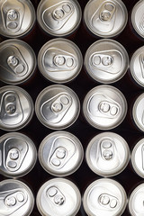 Group of aluminum cans with beer or soda. Top view.