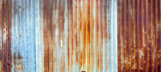 Background texture of the wall of old zinc sheet, metal sheet with rusty texture, rusty metal sheet, rusty zinc texture.