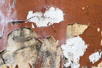 Old brown peeling wall paint. Texture background Cement wall.