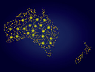 Yellow mesh vector Australia and New Zealand map with glitter effect on a dark blue gradiented background. Abstract lines,