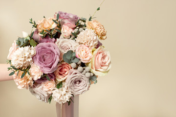 Close-up bouquet of flowers on the round white table indoors
