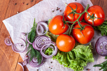 Fresh fragrant salad with tomatoes, cucumbers, onions, parsley, dill and lettuce leaves. Vegetarian...